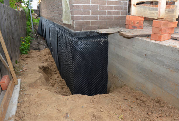 SJ Waterproofing Pros technician performing targeted Emergency Waterproofing assessment in Huron, OH